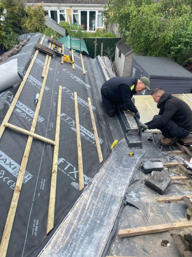 dj roofing meath team fixing a roof